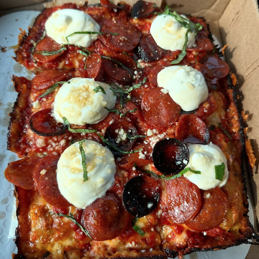 close up meat and cheese pizza