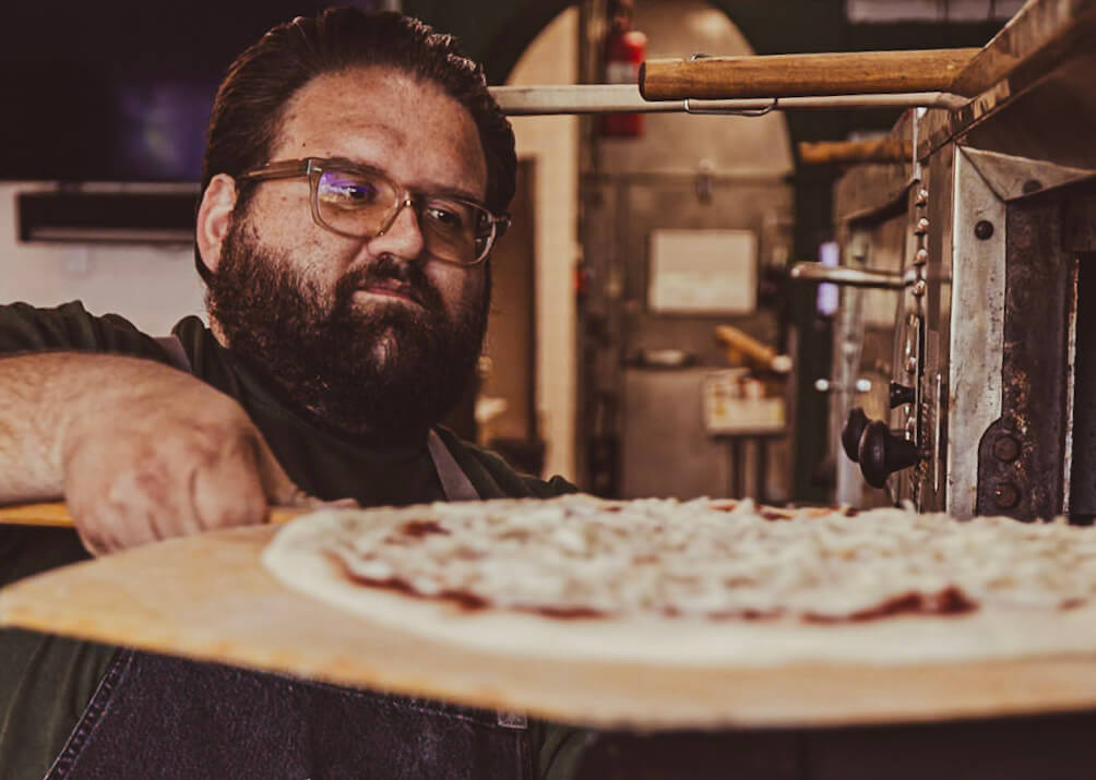 Dom pizza in oven (1)